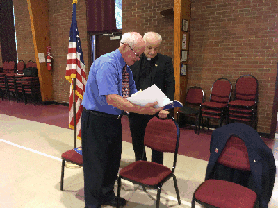 Worhty Trustee Bob Hall Reviews Induction Ceremony with Worthy Chaplain Father Larry LoMonaco